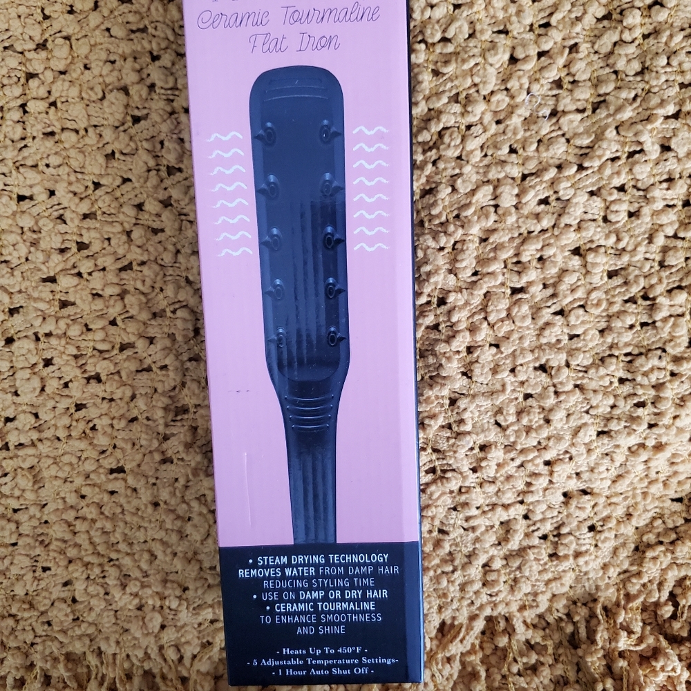 Plugged in Wet & Dry ceramic tourmaline flat iron.